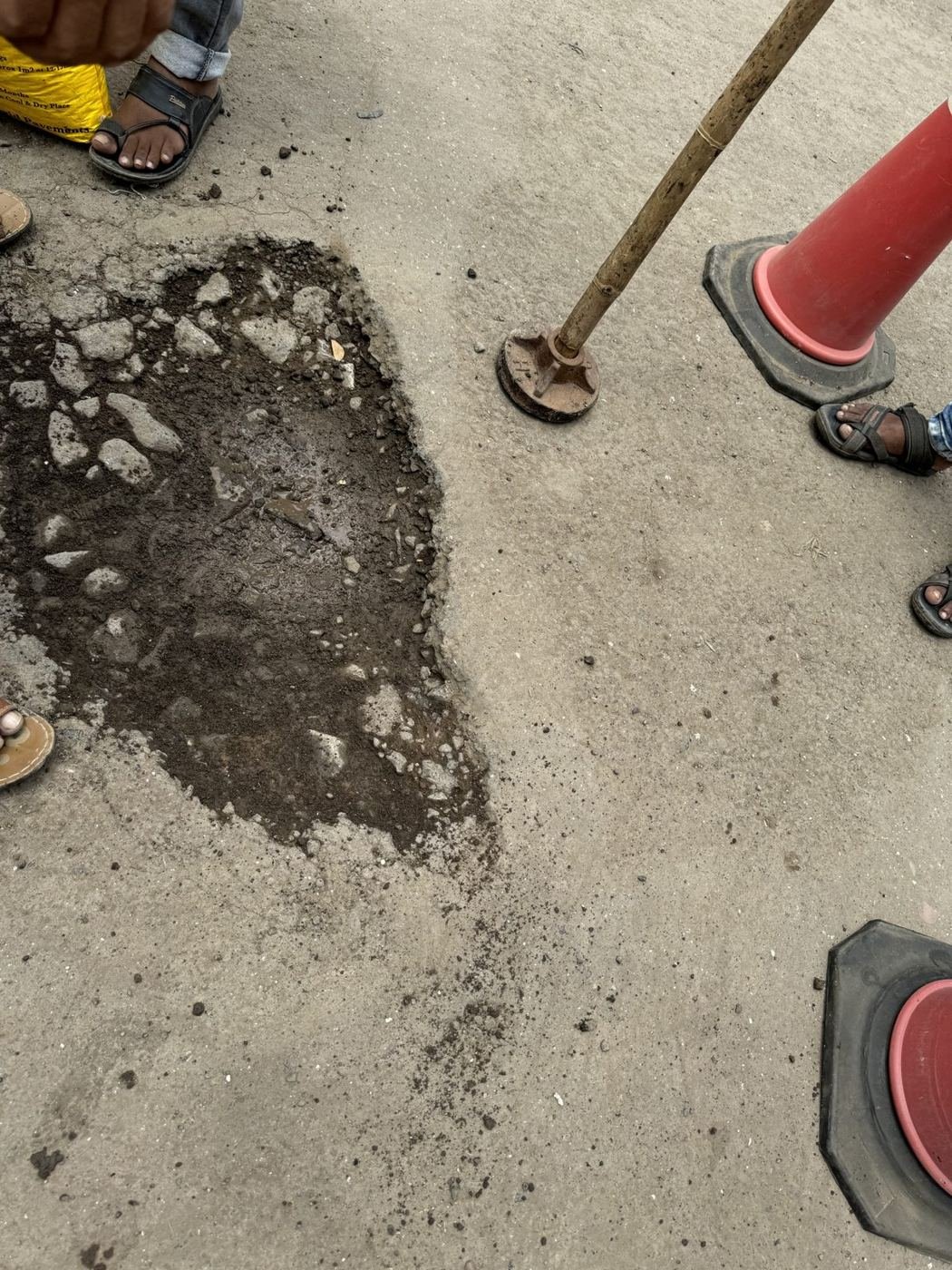 Before: an open pothole on a city road