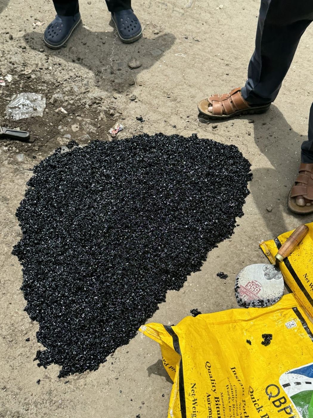 After: the same pothole filled with Quick Patch
